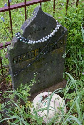 Adorned with beads and a hat...