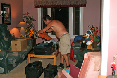 Ron packing a LOT of suitcases