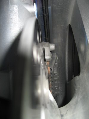 You can see the top side by looking down in through the fender with a light