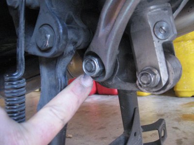 Loosen and remove lower tie rod nut