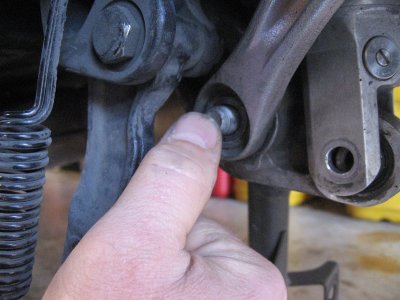 Remove the lower tie rod bolt