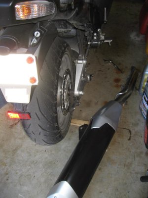 To install the Ohlins, you'll need to remove the muffler