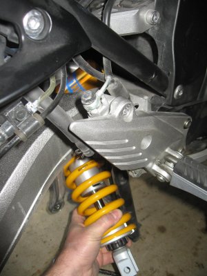 The Ohlins shock has to be installed from the bottom right side. The reservoir should point toward the front right
