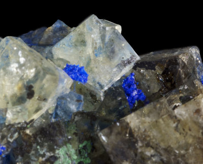 Fluorite twin (with complex corner modifications), 5 mm, with azurite and malachite, Great Sled Dale Mine, N Yorkshire.