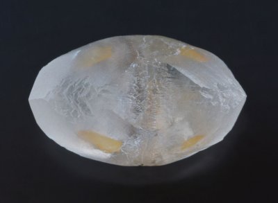 Twinned calcite crystal (17mm) from Landelies, Belgium shows selectively coated scalenohedral faces from an earlier growth stage