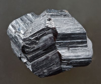 Rutile cyclic eightling twin, 13 mm, Magnet Cove, Arkansas, USA.