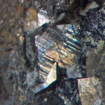 Arsenopyrite twinned crystals to 5 mm with minor chalcopyrite and calcite in 25 mm matrix. Hesk Fell Mine, Ulpha, Cumbria.