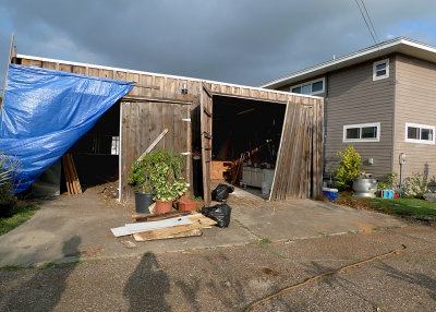 THE GARAGE HAD BEEN COMPLETELY FLOODED AND PUSHED OFF ITS FOUNDATION