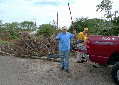 THE ROAD CREW, ARRANGING THE DEBRIS PILES AND KEEPING THE MAIN ROAD CLEAR