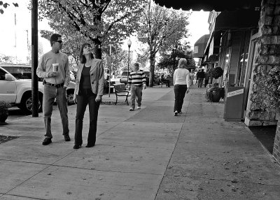 TOURISTS ON HENDERSONVILLE'S MAIN STREET - CAMERA HELD AT WAIST LEVEL, WHILE WALKING
