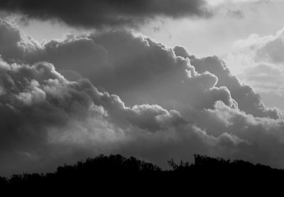 STORM CLOUDS ROLLING OVER THE MOUNTAINS