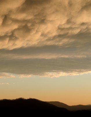 STORM CLOUDS AT SUNSET