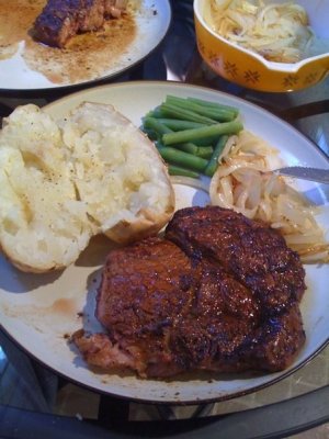Chili-lime Rib Eye with baked potato, green beans, and saute onions