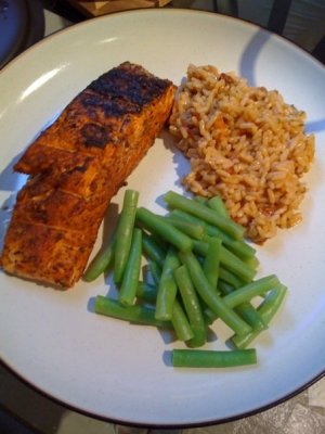 Salmon filets with Northwest spice rub, sundried-tomato basil rice, and steamed green beans