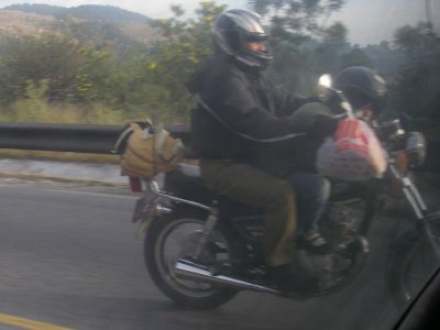 man w chile sleeping on bikesm.JPG