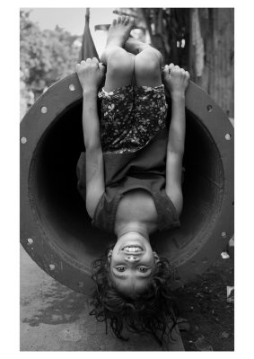 Child playing in pipes