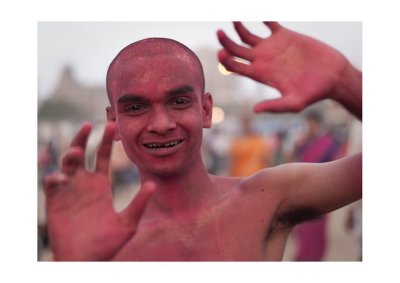 Man covered with coloured dust, Chowpatty Beach, Ganpati celebrations