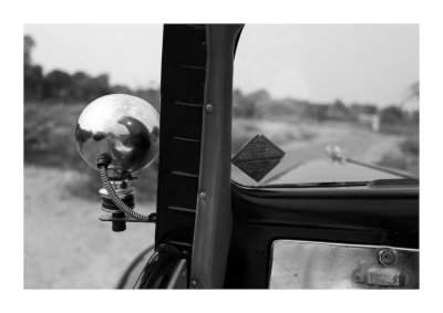Self-portrait in the mirror of a vintage car, Rajasthan