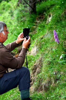 John photographing and orchid in Echo Valley