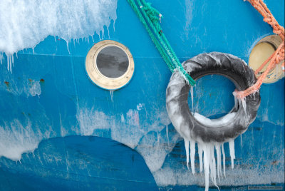 Fishing boat window with ice
