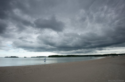 Life buoy on a cloudy beach