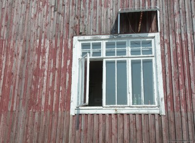 Window under a solar panel