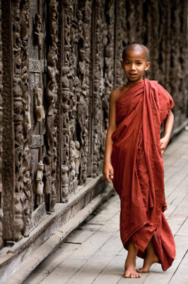 Young Novice with carved wall