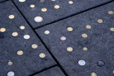 Lots of sidewalks with coins embedded