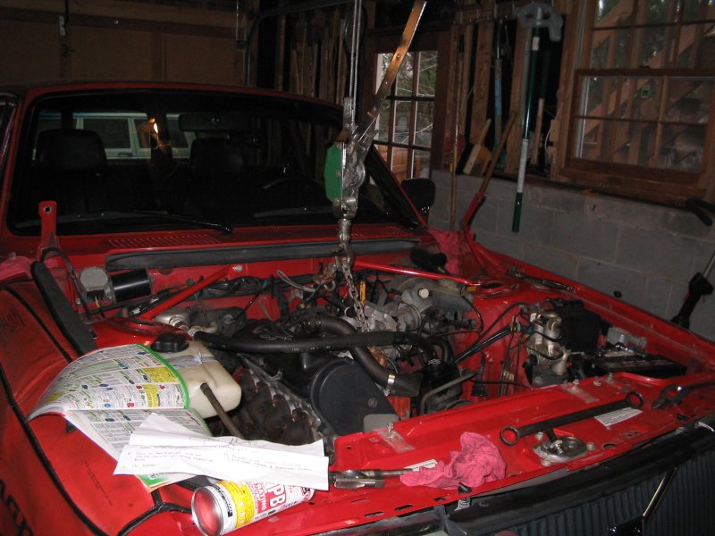 Supporting the motor so I could drop the front cross member & the oil pan to drill the return hole in the block