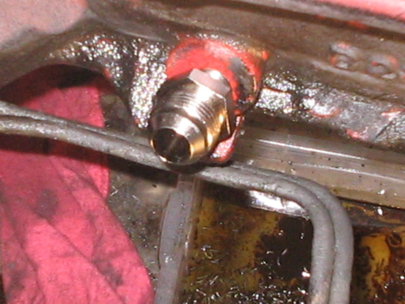 Tapping the return line hole