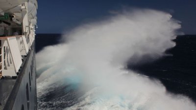 Pushing through big swells