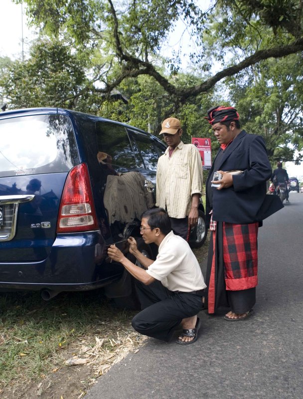 x our driver examines the damage.jpg