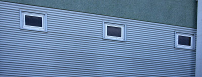 Windows in Blue Steel Wall