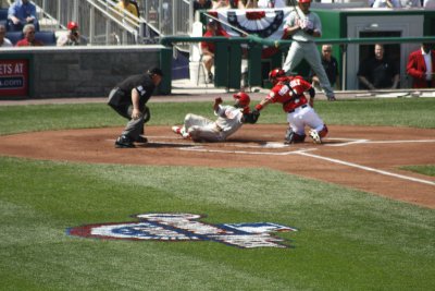 Pudge tags out Rollins at the plate