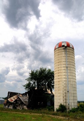 Barn, Silo And Clouds