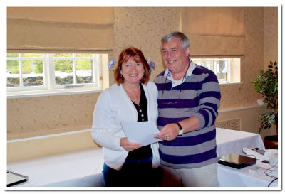 Then .... he presents her with a well deserved Licentiatehip distinction certificate