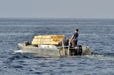 Load of lumber off to one of the Broken Islands