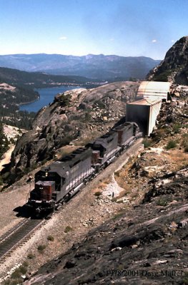 This photo was taken maybe 30 years ago.  Westbound Southern Pacific 8974 exiting Tunnel 7 with tonnage bound for northern California.  The locomotives' dynamic brakes are about to be subjected to the longest continuous railroad downgrade in the United States, a drop of 6,000 feet in elevation.