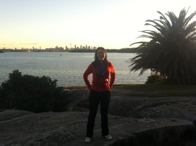 Pam with the Sydney skyline in the background near Camp Cove