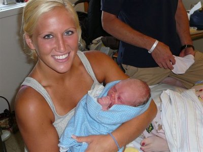 Emily holding Harrison 6-4-08.jpg