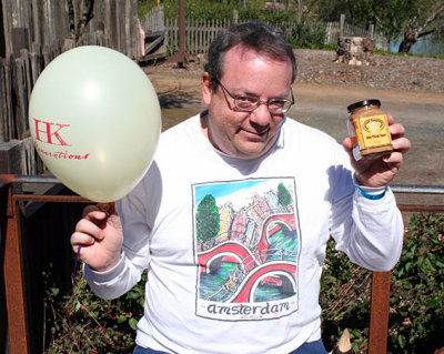 Alan is happy; he's got a balloon and satay sauce.