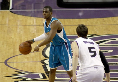 Hornets superstar point guard Chris Paul brings up the ball against Andrs Nocioni