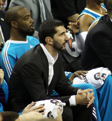 Injured former King and current Hornet Peja Stojakovic sits on the bench