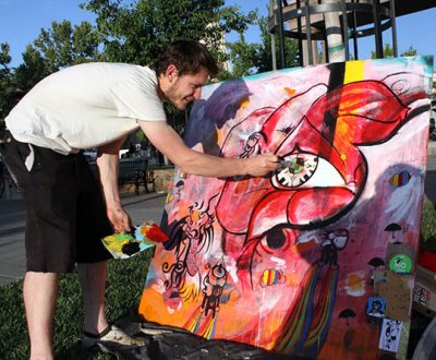 Chico artist Micah dots the eye on his artwork