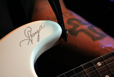 Henry's guitar logo and tattoo