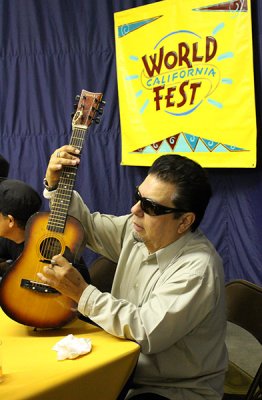 Cesar Rosas signs mini-guitar