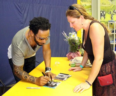 Leroy Bell signs a CD for a fan