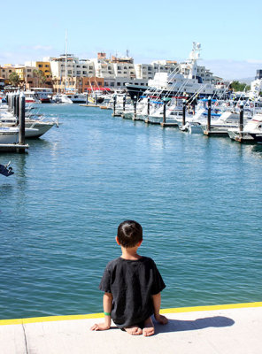 Child checks out the marina at Cabo San Lucas