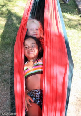 Peas in a pod-two young ones comfortably nestled in a hammock