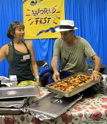 Backstage.hospitality chef Dave Guzzetti sets down a tray of enchiladas